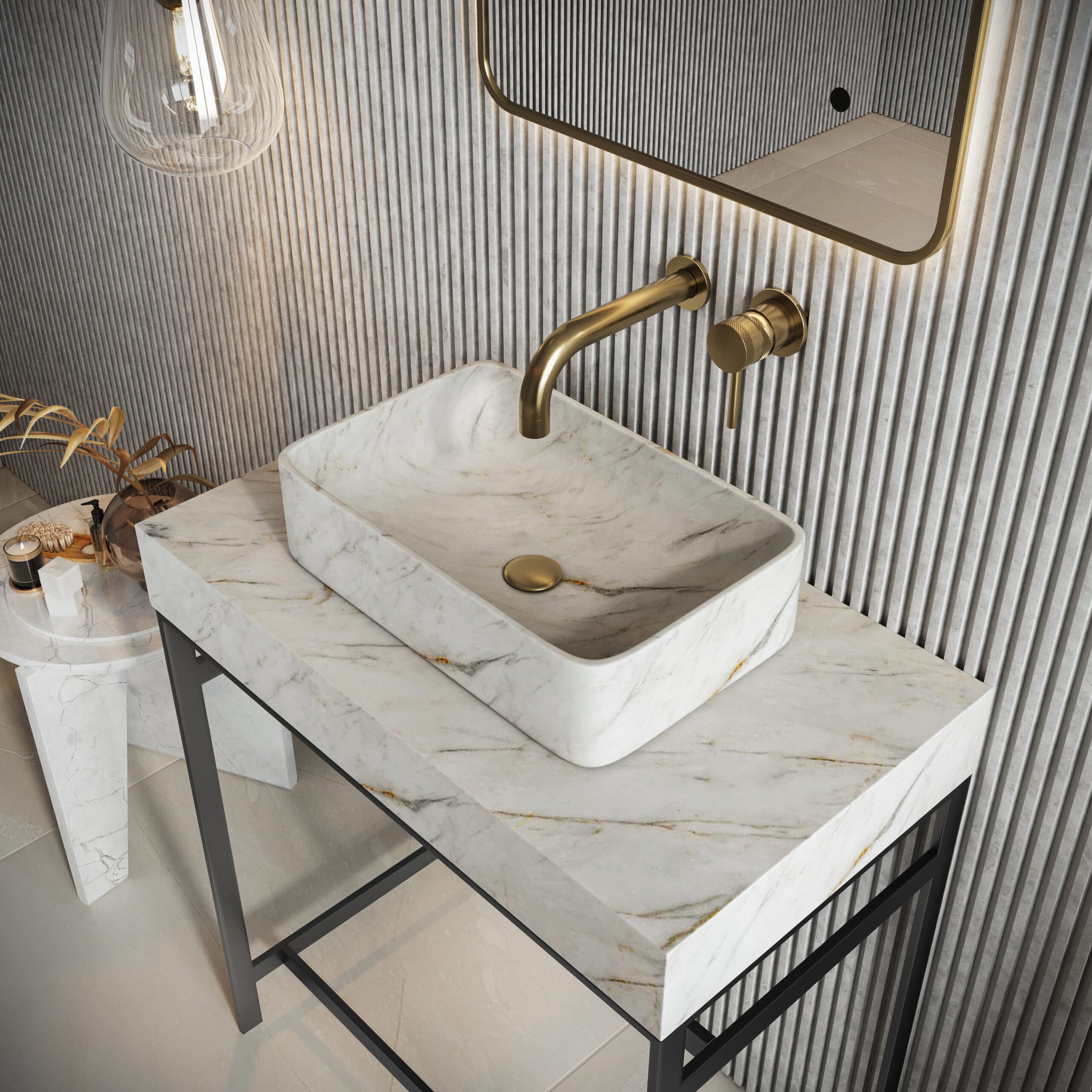 Veined rectangular marble basin on a matching washstand beneath a gold-coloured wall tap
