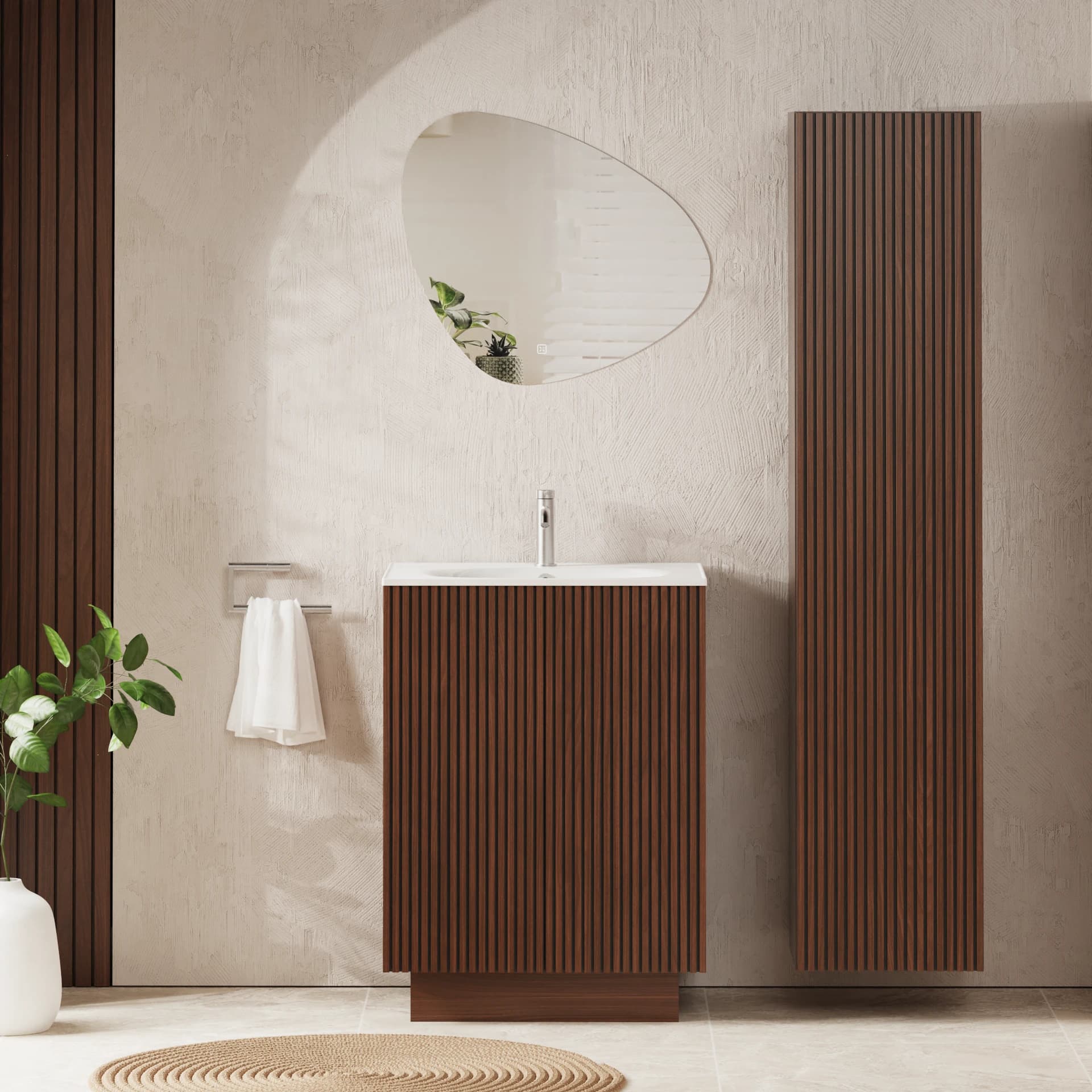 Woodgrain fluted tall cabinet alongside matching vanity furniture and an asymmetric mirror