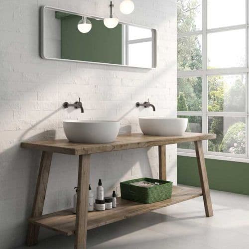 Two white basins on an open timber washstand against white brick-effect wall tiles.
