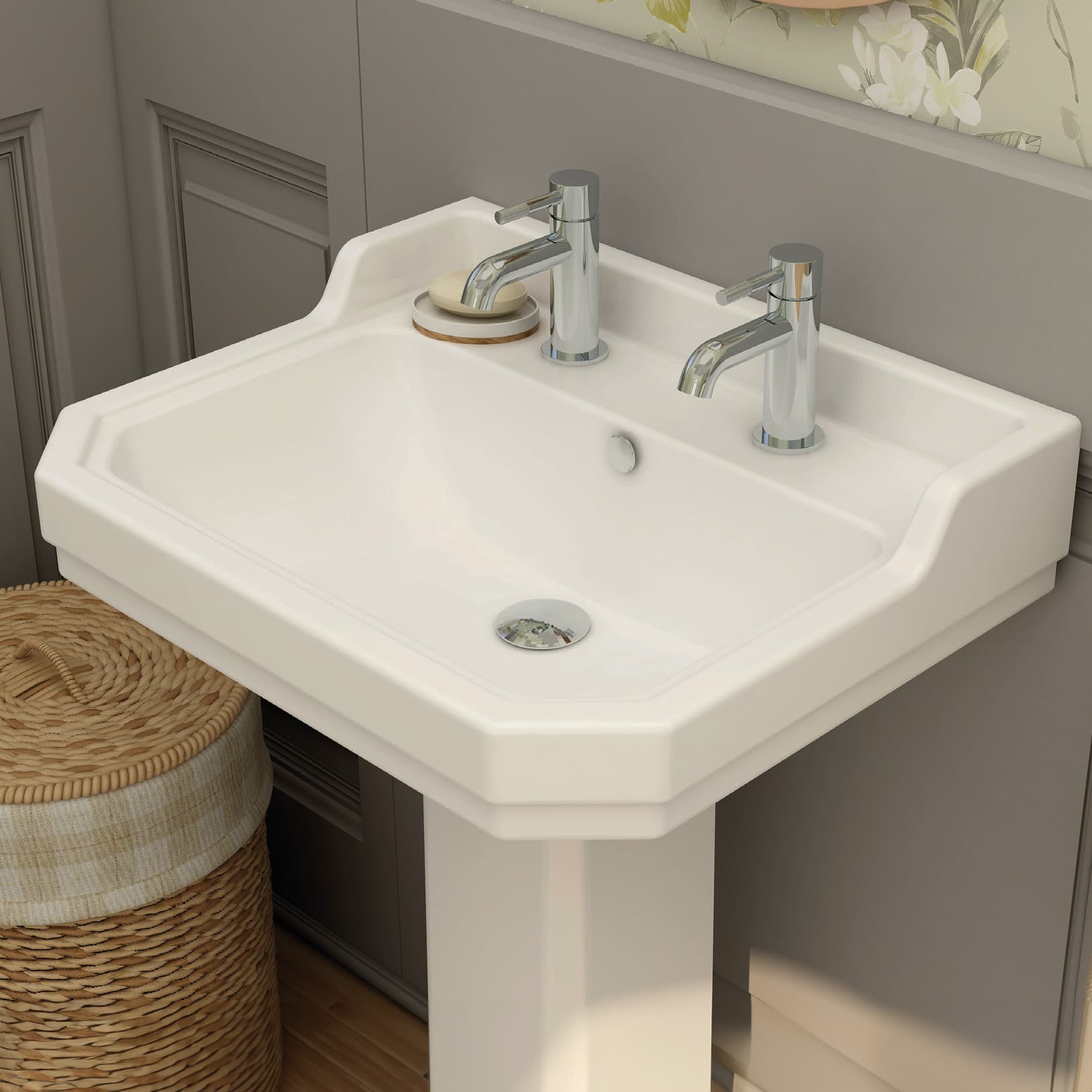 Traditional white basin with two chrome taps and a full pedestal