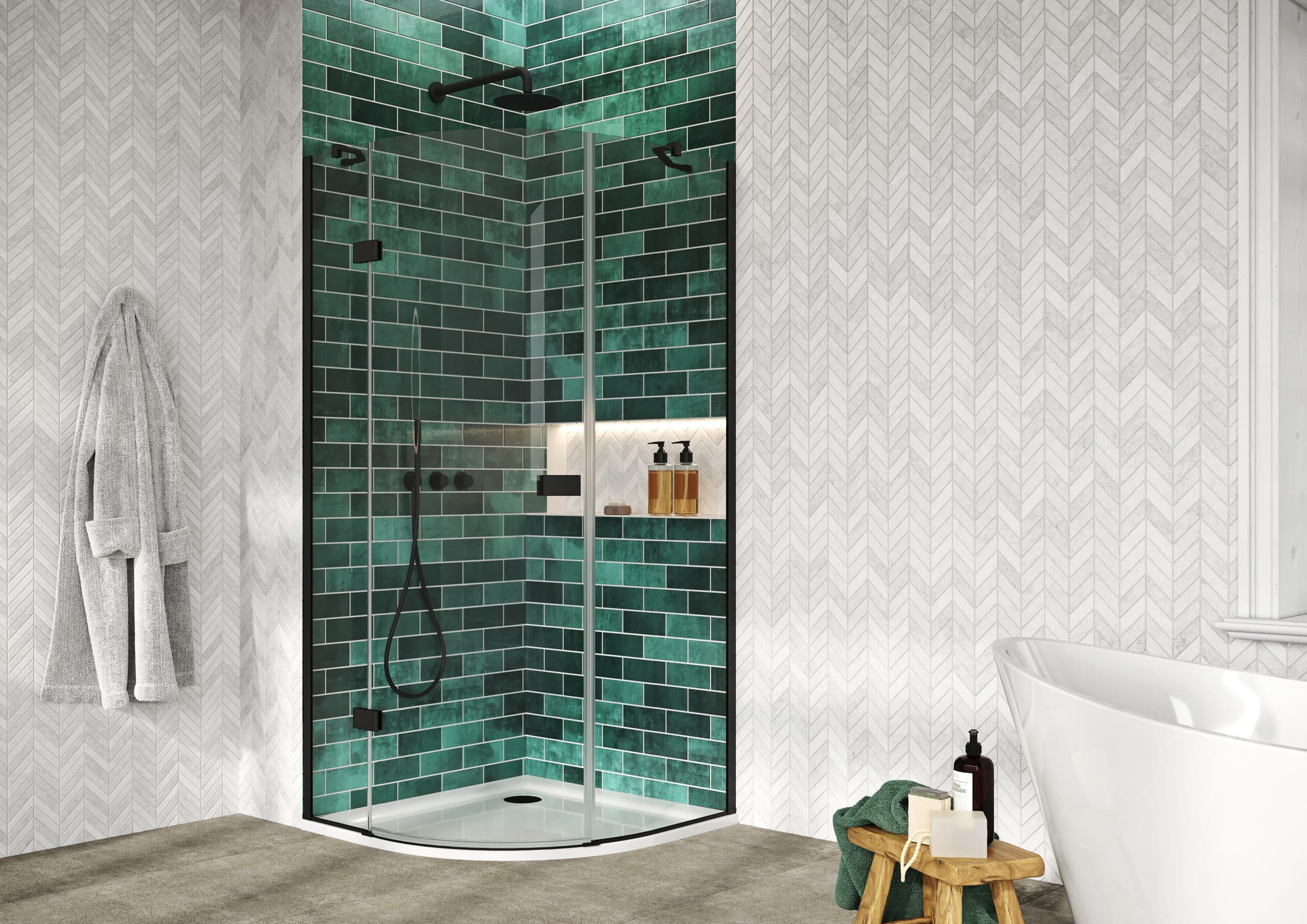 Curved black-edged shower enclosure against green brick and white herringbone walls