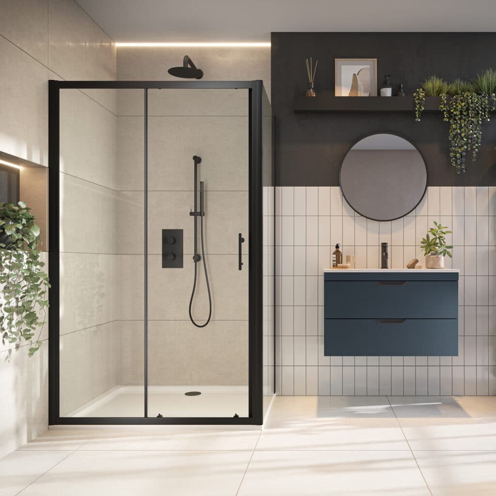 Black-framed sliding shower enclosure beside a blue vanity in a pale tiled bathroom