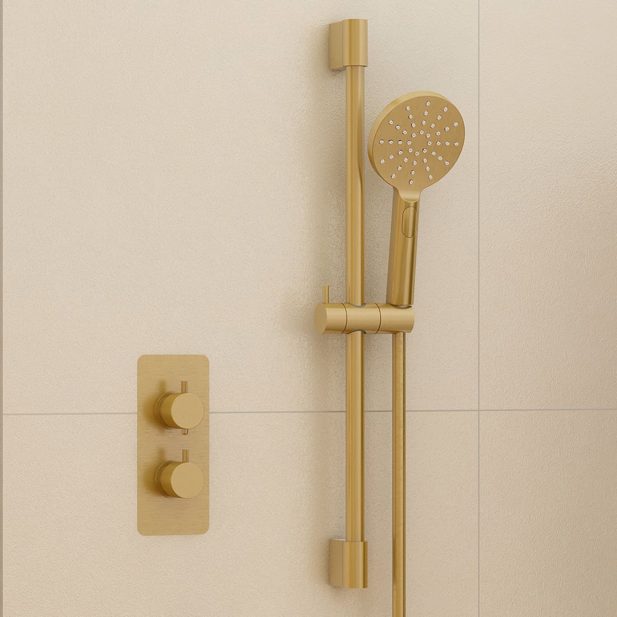 Brass-coloured rail and handset beside two wall controls on beige tiles
