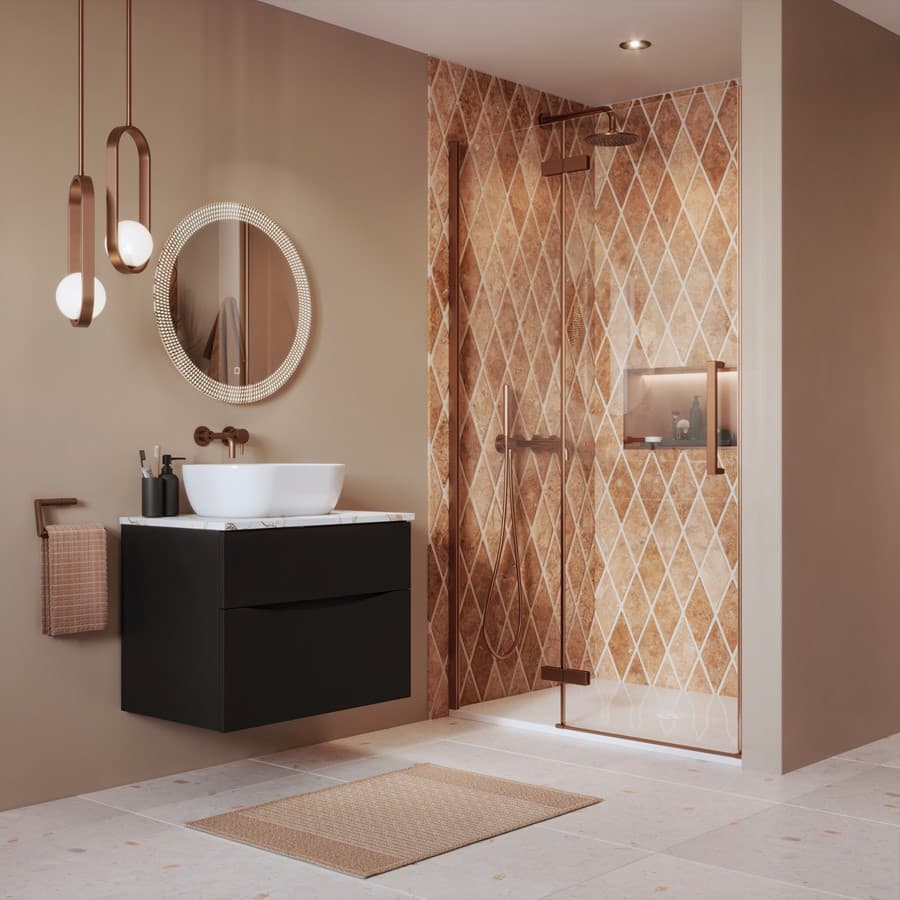 Bronze-coloured shower enclosure above a white tray against terracotta diamond tiles