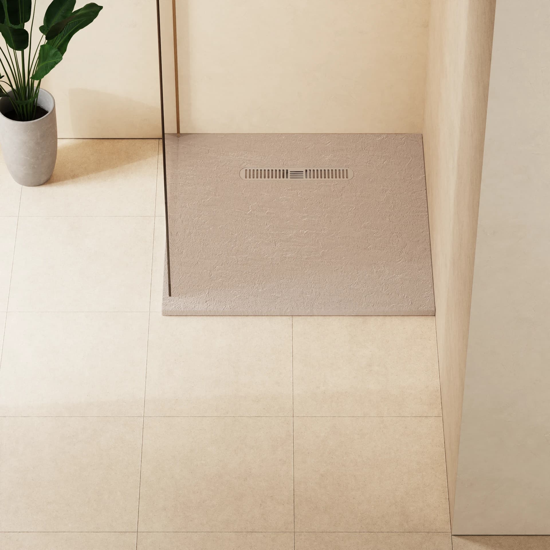 Square textured shower tray with a long inset waste cover and an adjacent glass screen.