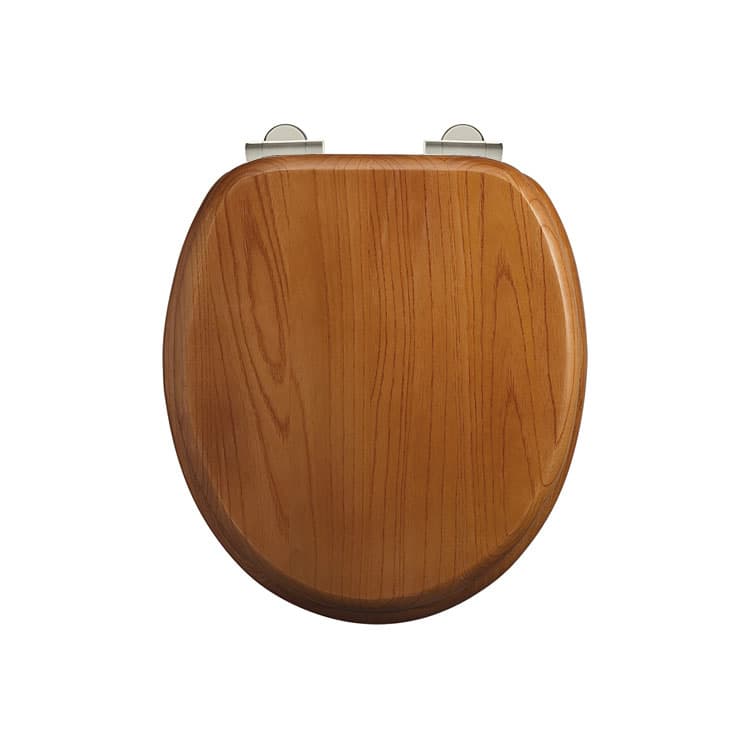 Oak-coloured toilet seat viewed from above with two metal hinge covers