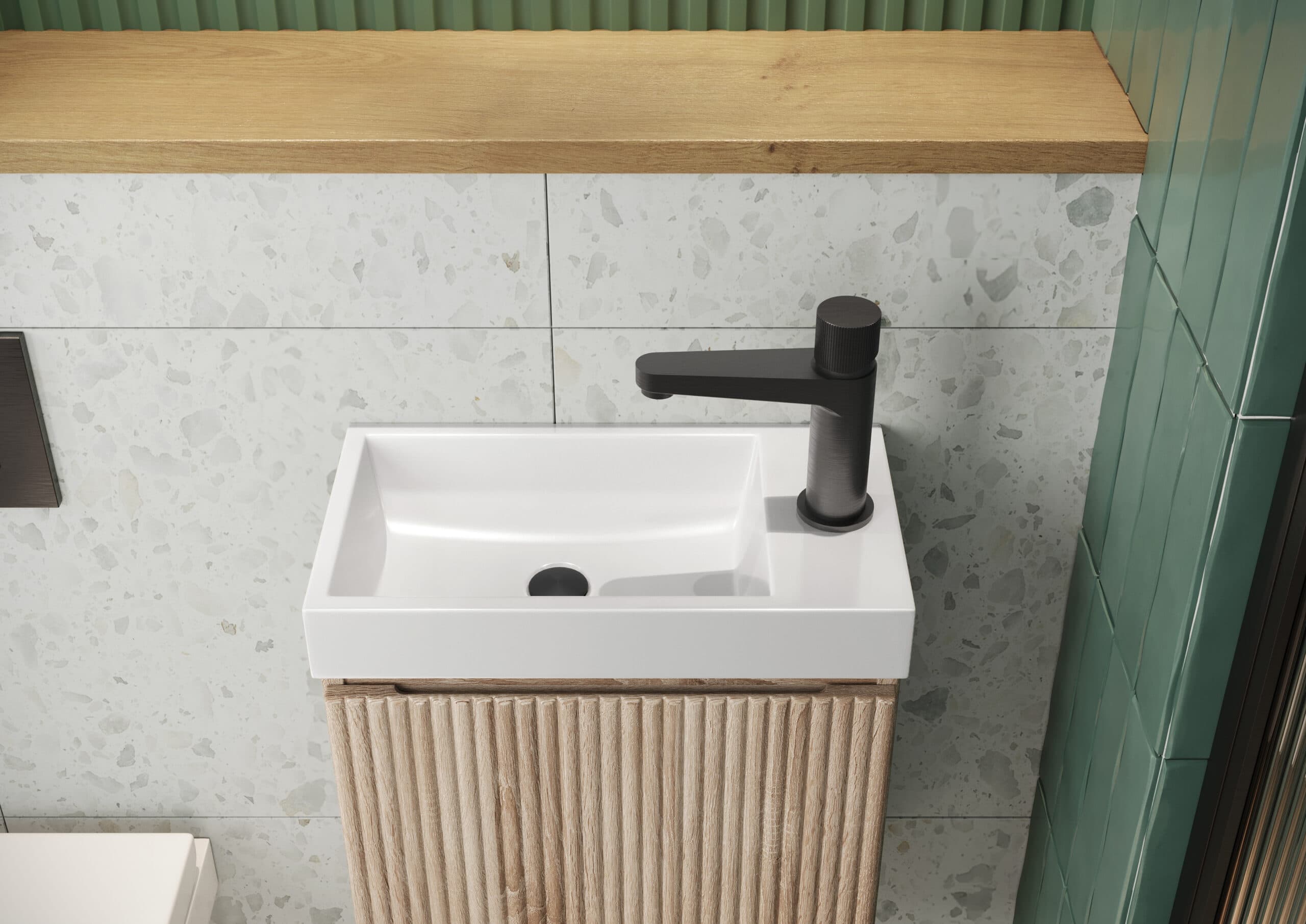 Compact white basin with a side-mounted black tap over fluted woodgrain furniture