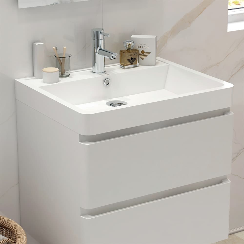 White two-drawer vanity and rectangular basin with a chrome tap
