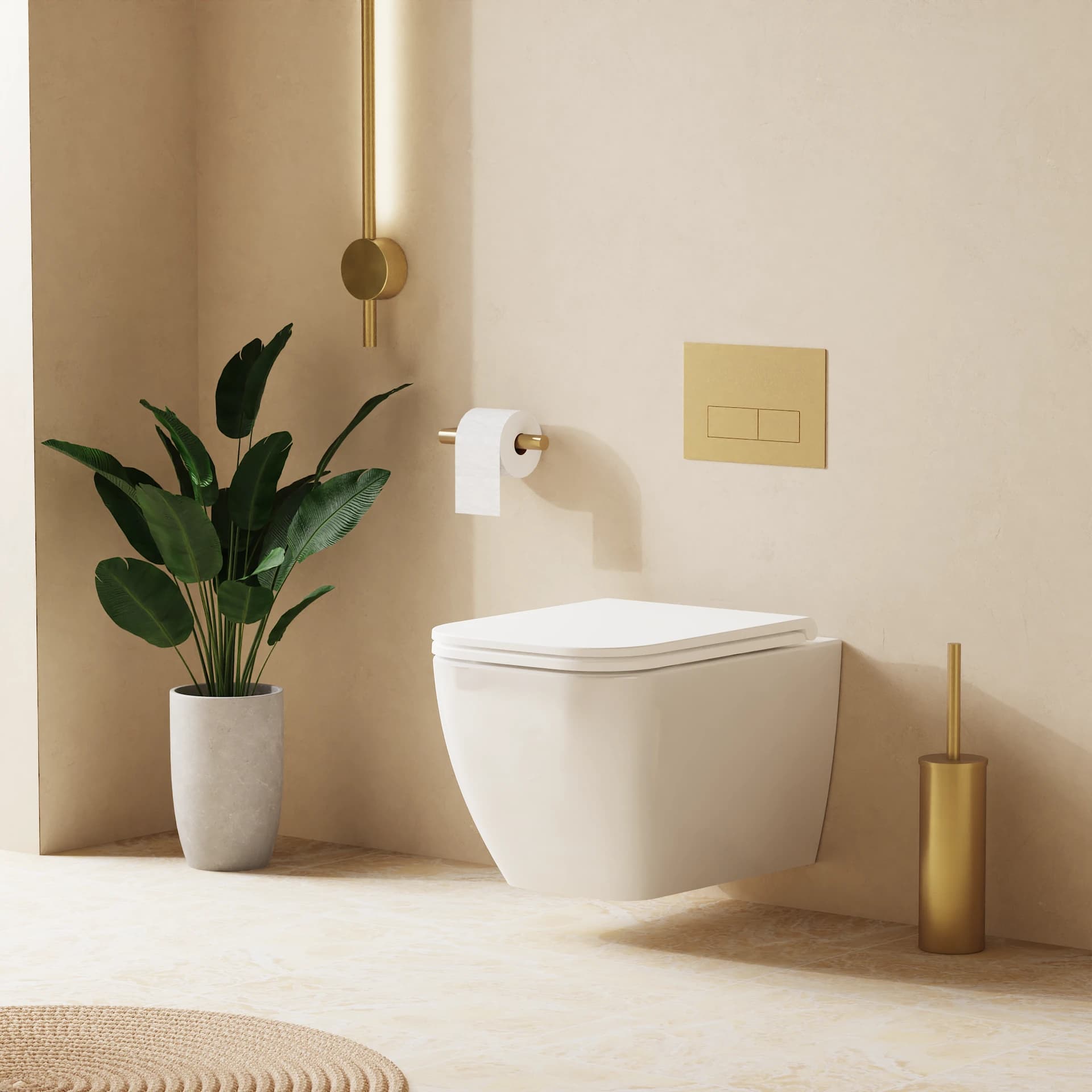 White wall-hung toilet below a gold-coloured flush plate against a pale wall.