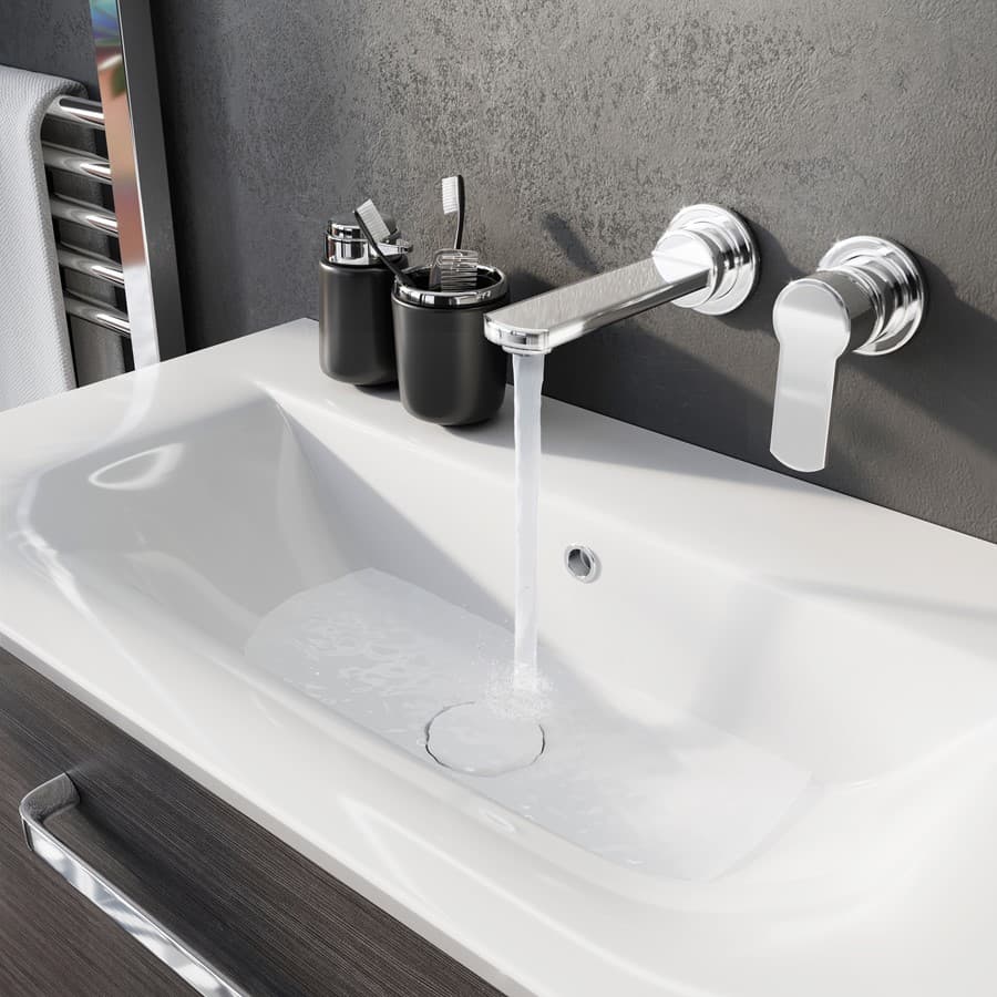 Chrome wall-mounted spout and lever above a rectangular white basin